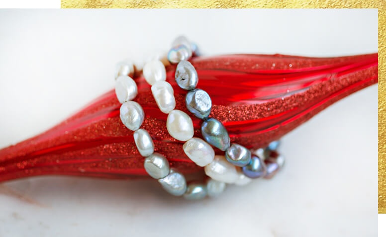 Pearl bracelets on a Christmas ornament 